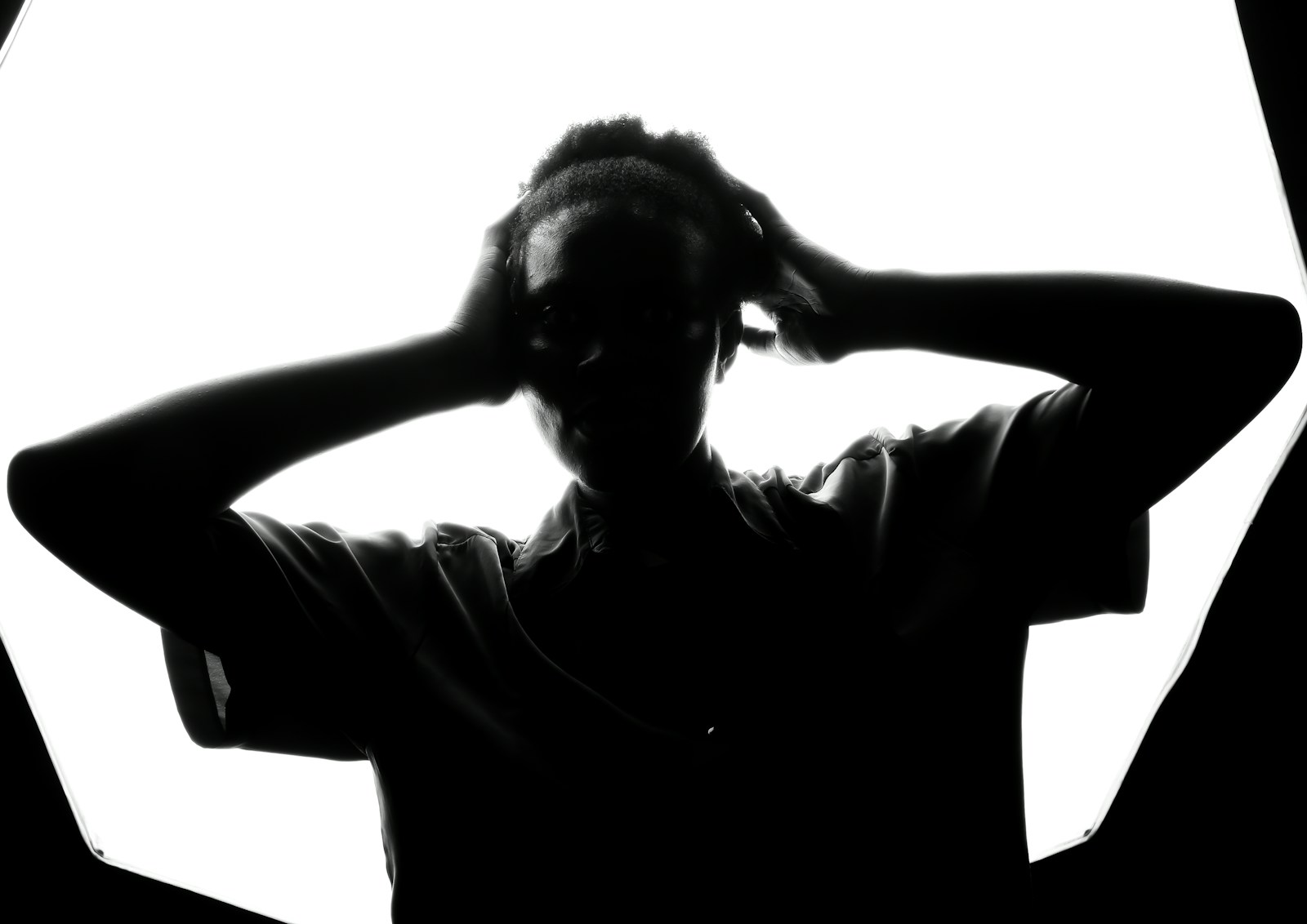a person standing in front of a white background